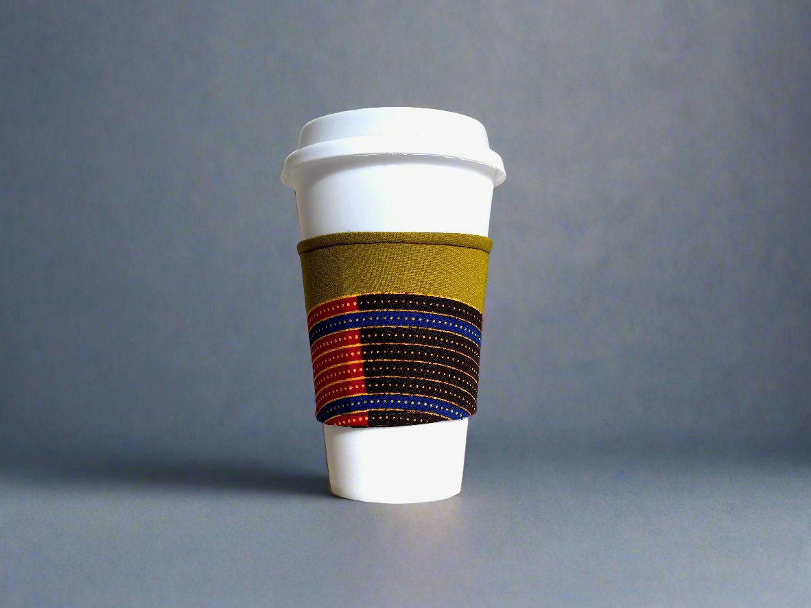 Handmade Cup Sleeve: Ethnic fabric design in green, brown, blue, red and gold. This vibrant and stylish cup sleeve adds a touch of cultural sophistication to your drinkware.