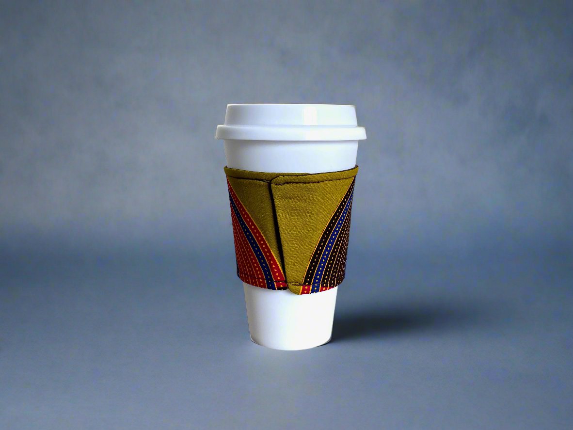 Handmade Cup Sleeve: Ethnic fabric design in green, brown, blue, red and gold. This vibrant and stylish cup sleeve adds a touch of cultural sophistication to your drinkware.