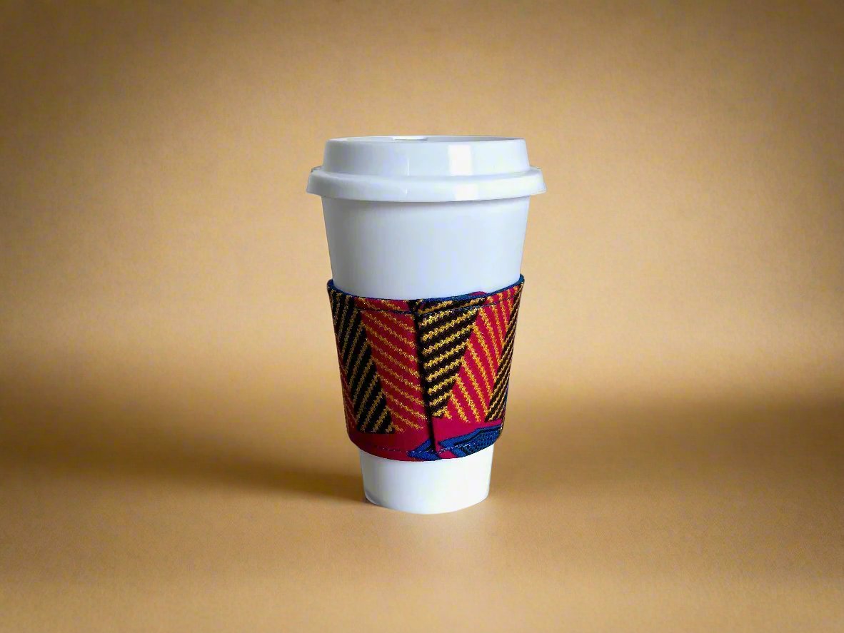 Handmade Cup Sleeve: Ethnic fabric design in berry, blue, green, brown, and gold. This vibrant and stylish cup sleeve adds a touch of cultural sophistication to your drinkware.