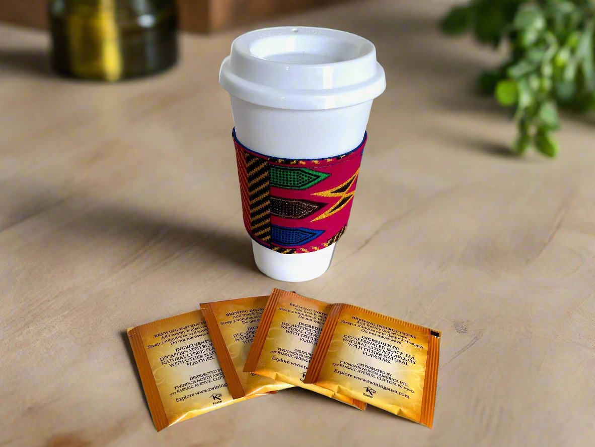 Handmade Cup Sleeve: Ethnic fabric design in berry, blue, green, brown, and gold. This vibrant and stylish cup sleeve adds a touch of cultural sophistication to your drinkware.