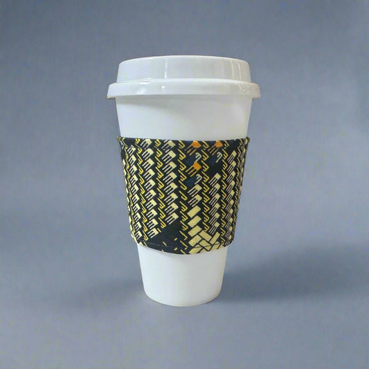 Handmade Cup Sleeve: Ethnic, fabric design with dark blue, maroon, and yellow patterns. This unique and stylish cup sleeve is perfect for adding a touch of elegance and cultural flair to your beverage.