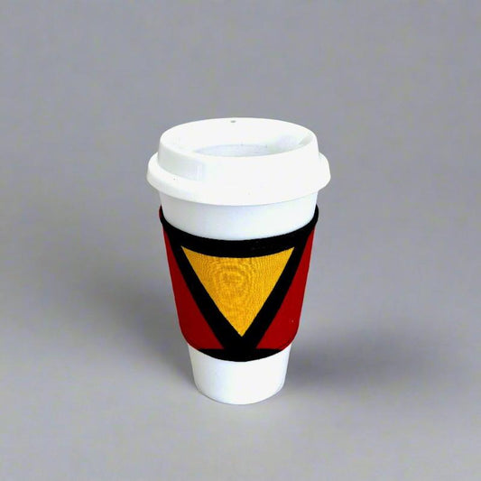 Handmade Cup Sleeve: Ethnic fabric design in black, red, and yellow. This eye-catching and culturally inspired cup sleeve adds vibrant style to your drinkware.