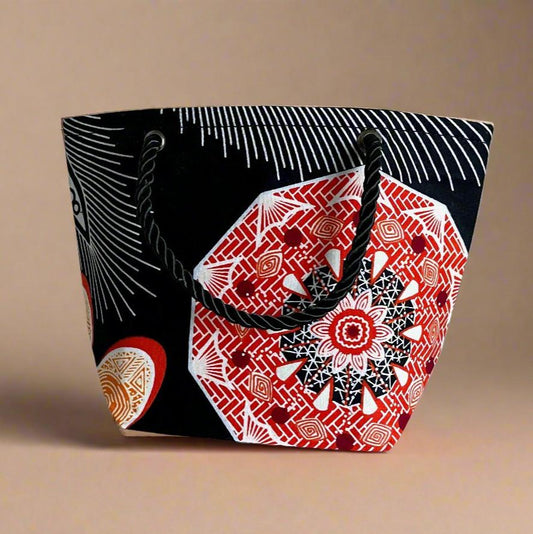 Handmade Mini Gift Tote Bag: Ethnic fabric design in black, orange, and white. This stylish and compact gift tote bag adds a touch of cultural elegance, perfect for presenting small gifts.