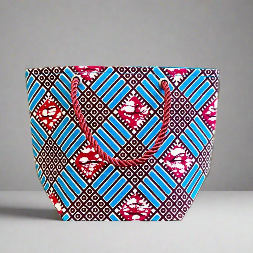 Handmade Mini Gift Tote Bag: Ethnic fabric design in turquoise, berry, and white. This stylish and compact gift tote bag adds a touch of cultural elegance, perfect for presenting small gifts.