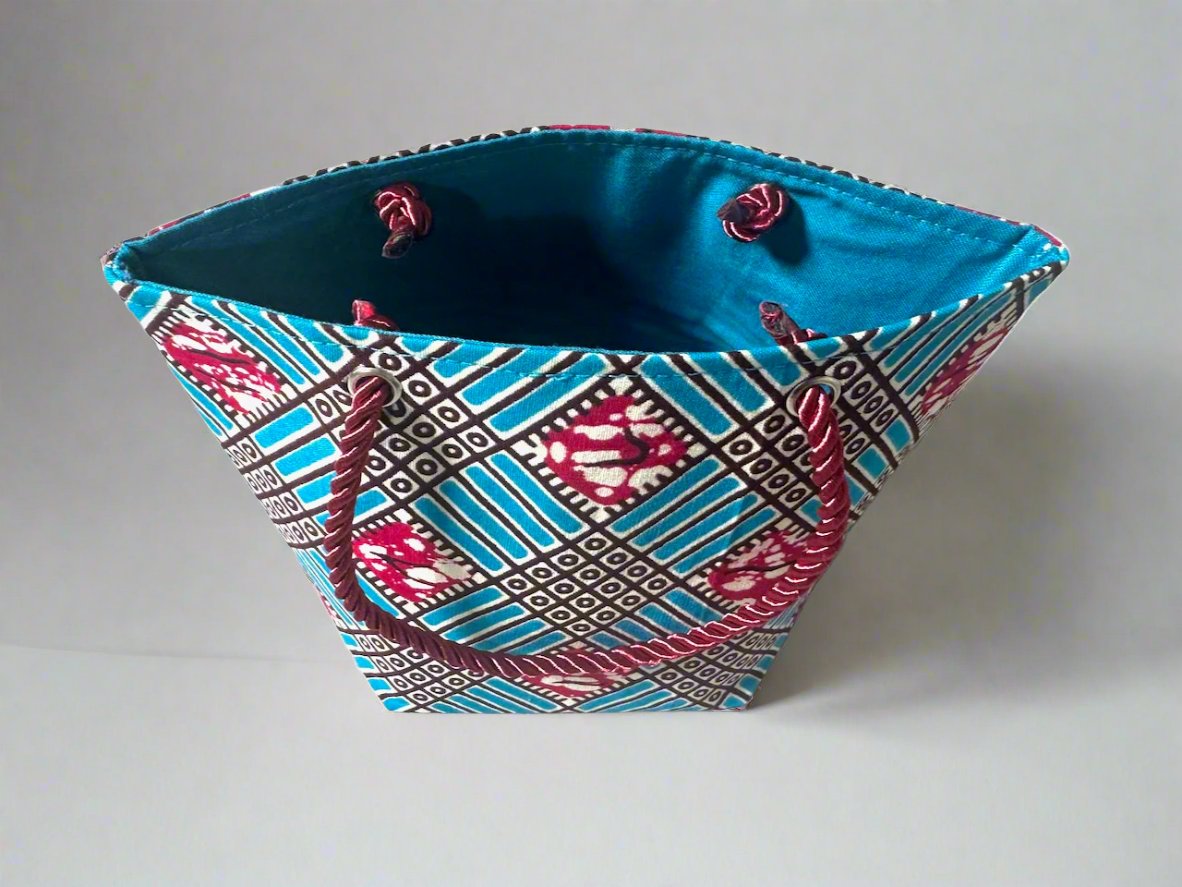 Handmade Mini Gift Tote Bag: Ethnic fabric design in turquoise, berry, and white. This stylish and compact gift tote bag adds a touch of cultural elegance, perfect for presenting small gifts.