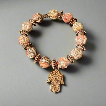 Unique Handmade Bracelet: Leopard Jasper Beads, Brass Spacers & Hand of Fatima Charm - Gezia Accents