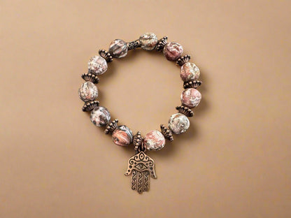 Unique Handmade Bracelet: Leopard Jasper Beads, Brass Spacers & Hand of Fatima Charm - Gezia Accents